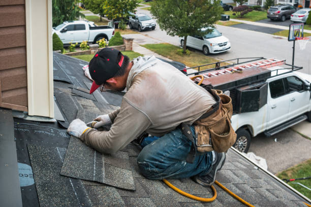 Professional Storm Damage Roof Repair technician working in Amston, CT